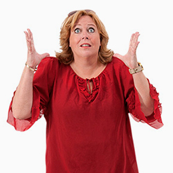 Karen-Marie wearing red blouse with sky-turned eyes and with hands raised in a resigned position